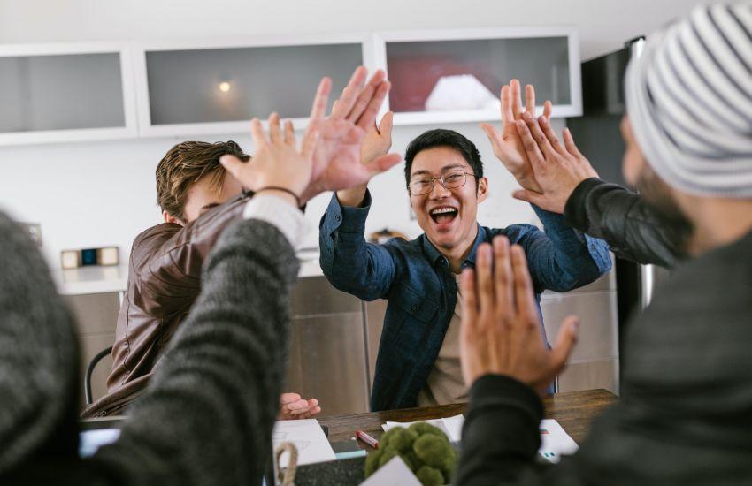 business meeting with people cheering