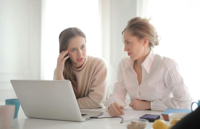 women frustrated at their laptop